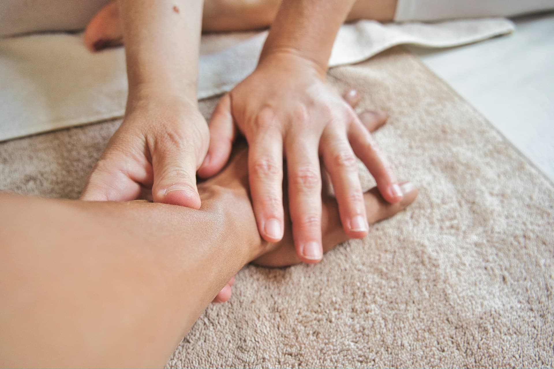 Woman receiving lymphatic drainage massage from a therapist to enhance detoxification, reduce swelling, and support immune health